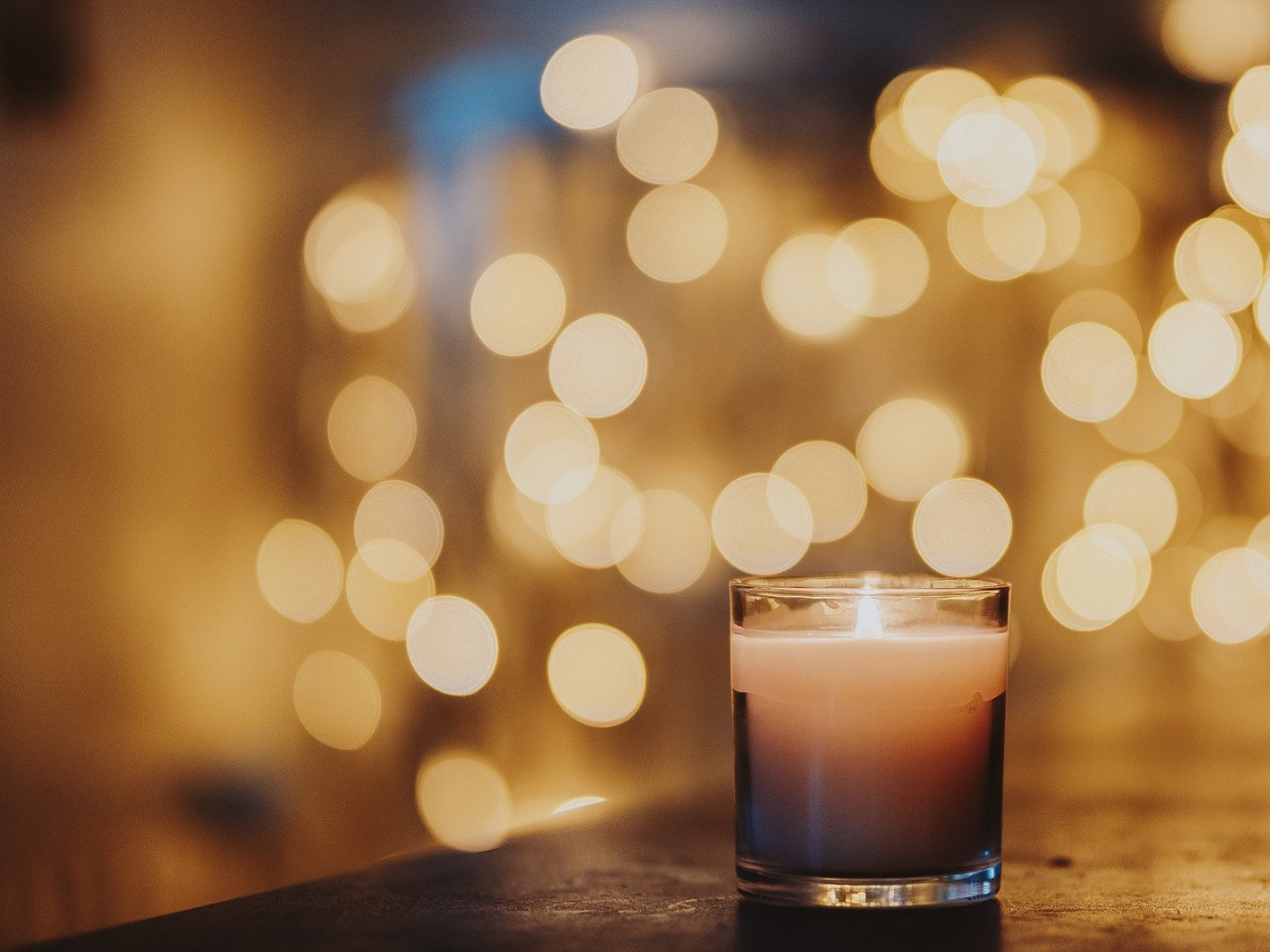 candle and Christmas lights during simbang gabi